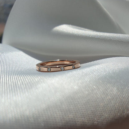 14K rose gold wedding band with 4 natural diamonds 