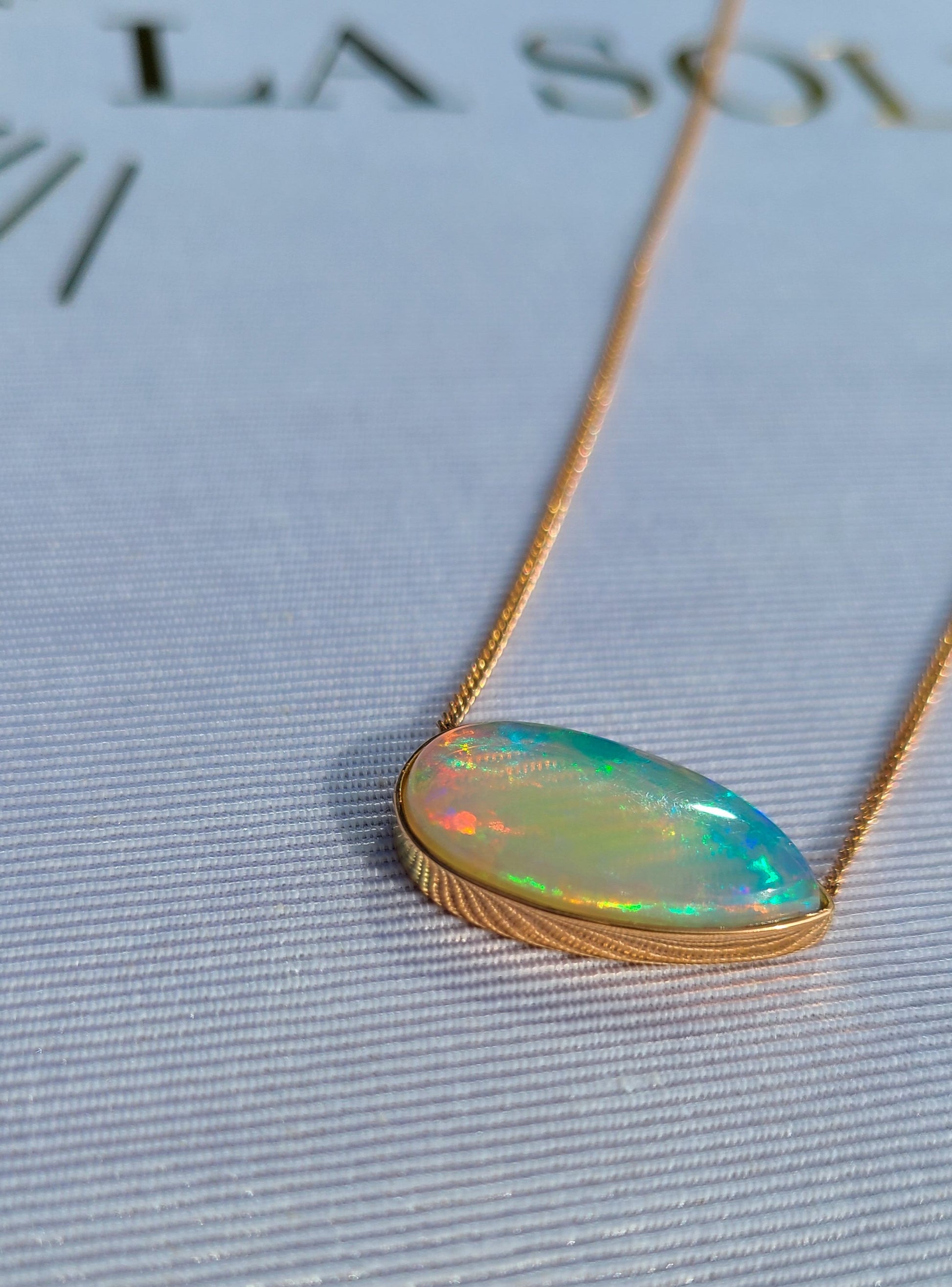 Big pear shape opal necklace in 14K rose gold