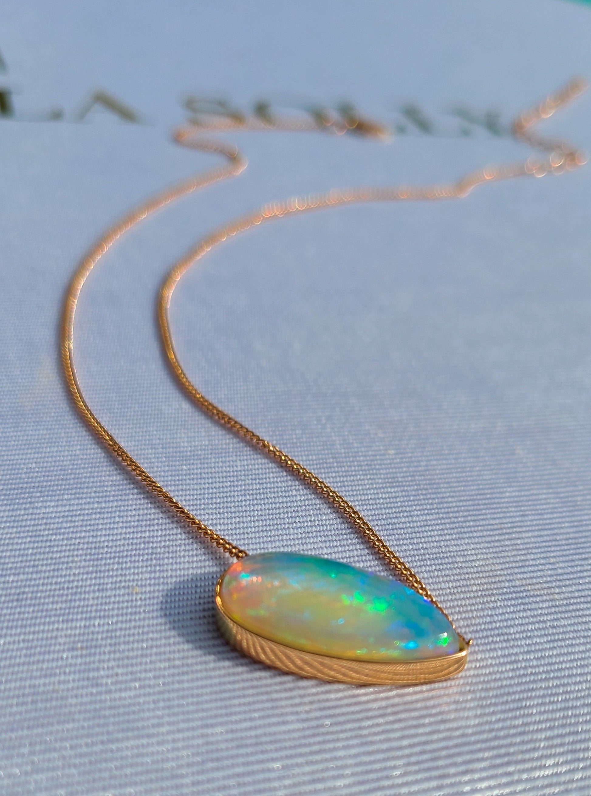 Big pear shape opal necklace in 14K rose gold