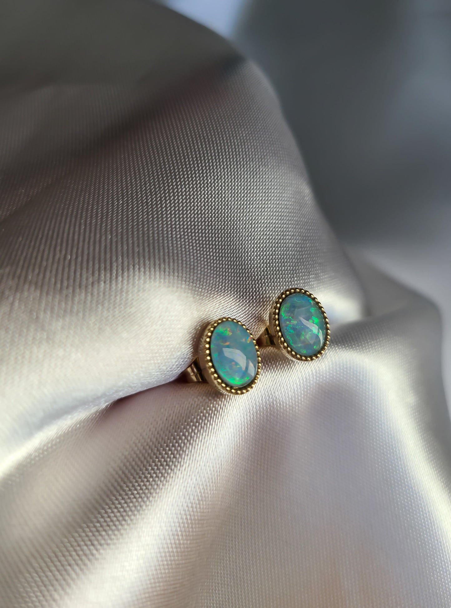 Beautiful oval shape opal earrings in 14K gold