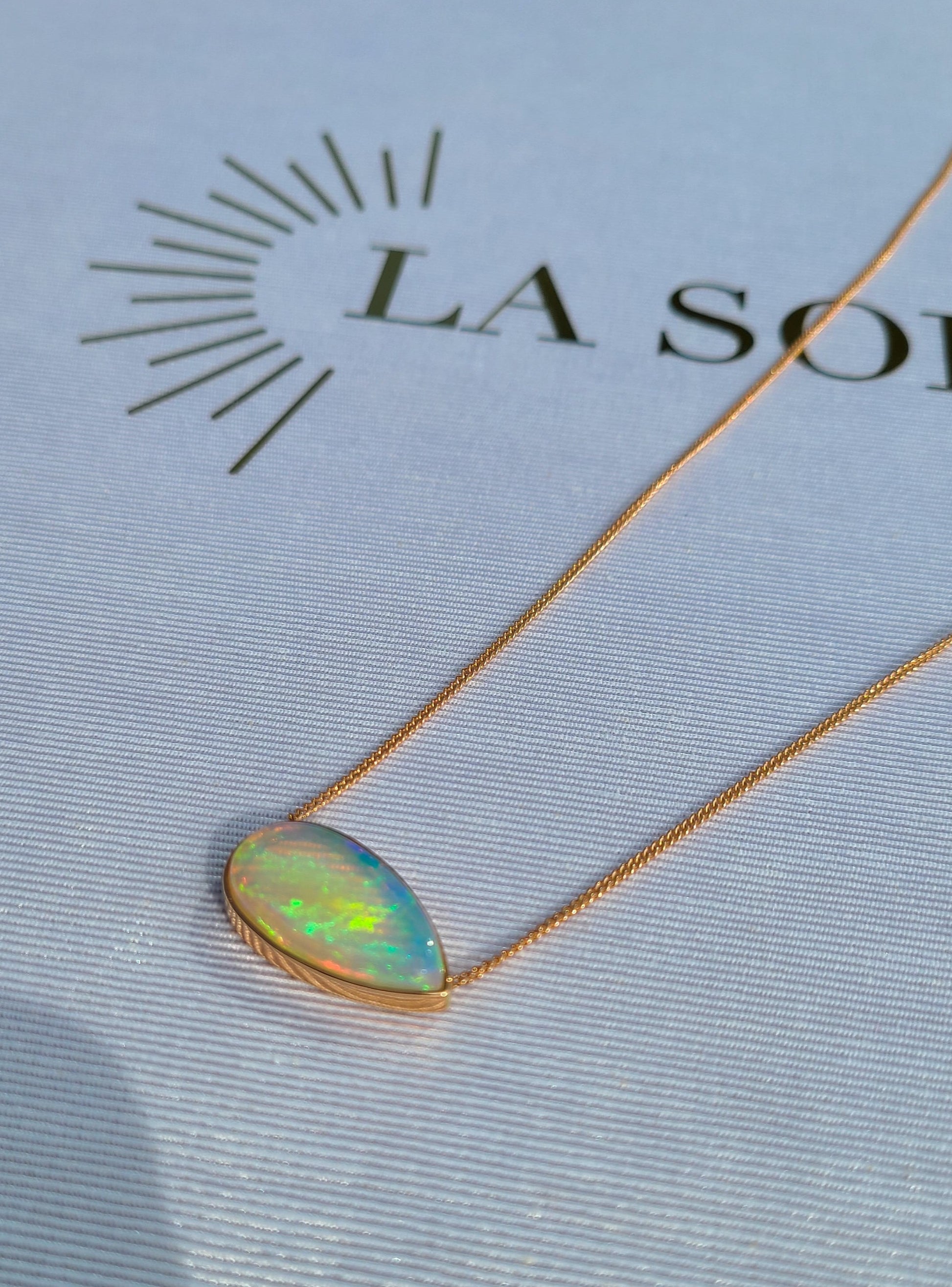 Big pear shape opal necklace in 14K rose gold