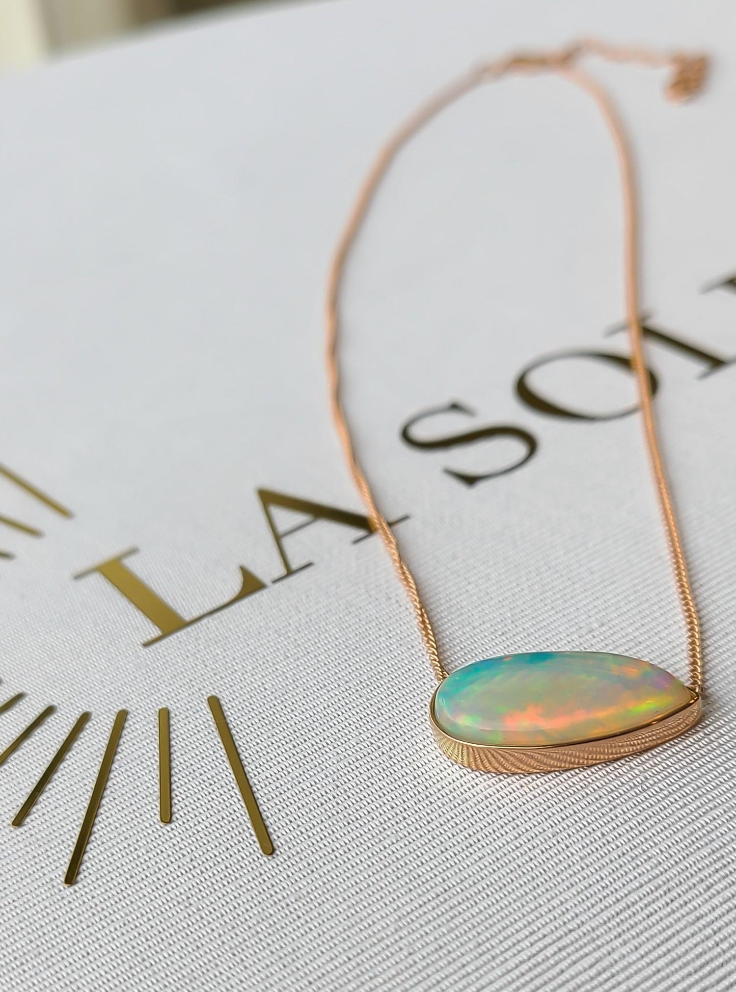 Big pear shape opal necklace in 14K rose gold