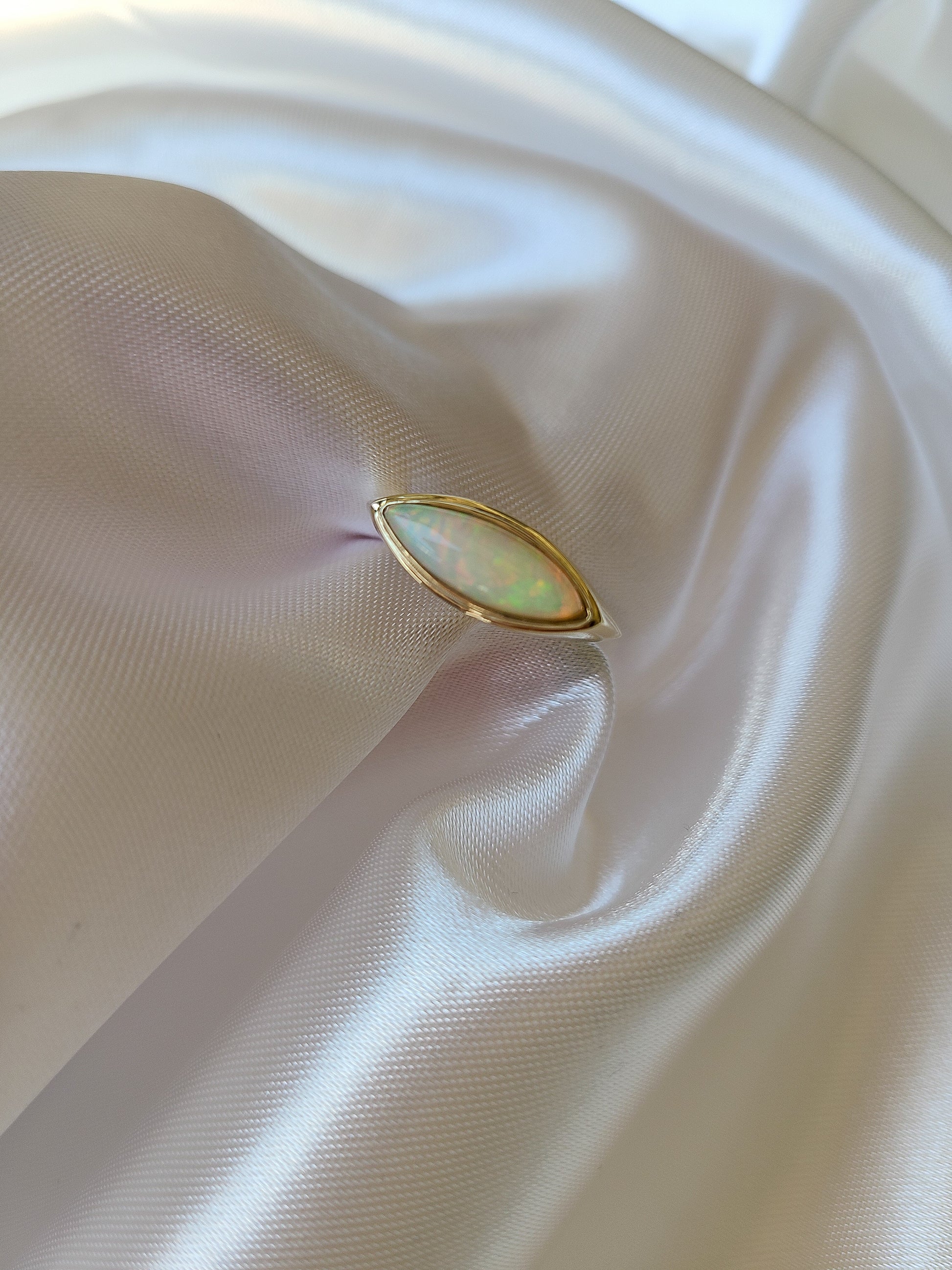 Elongated marquise shape opal ring in 14K gold