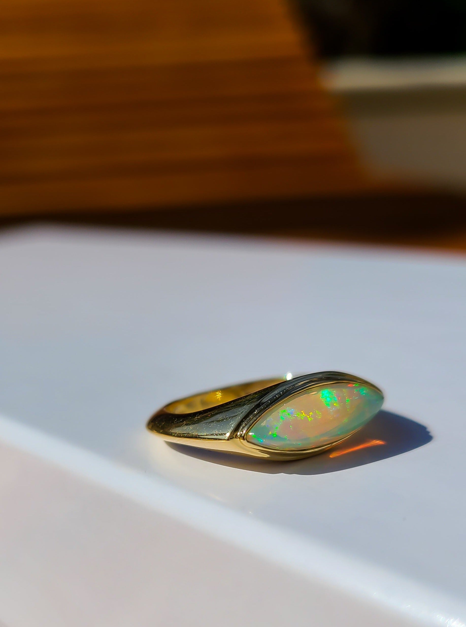 Elongated marquise shape opal ring in 14K gold