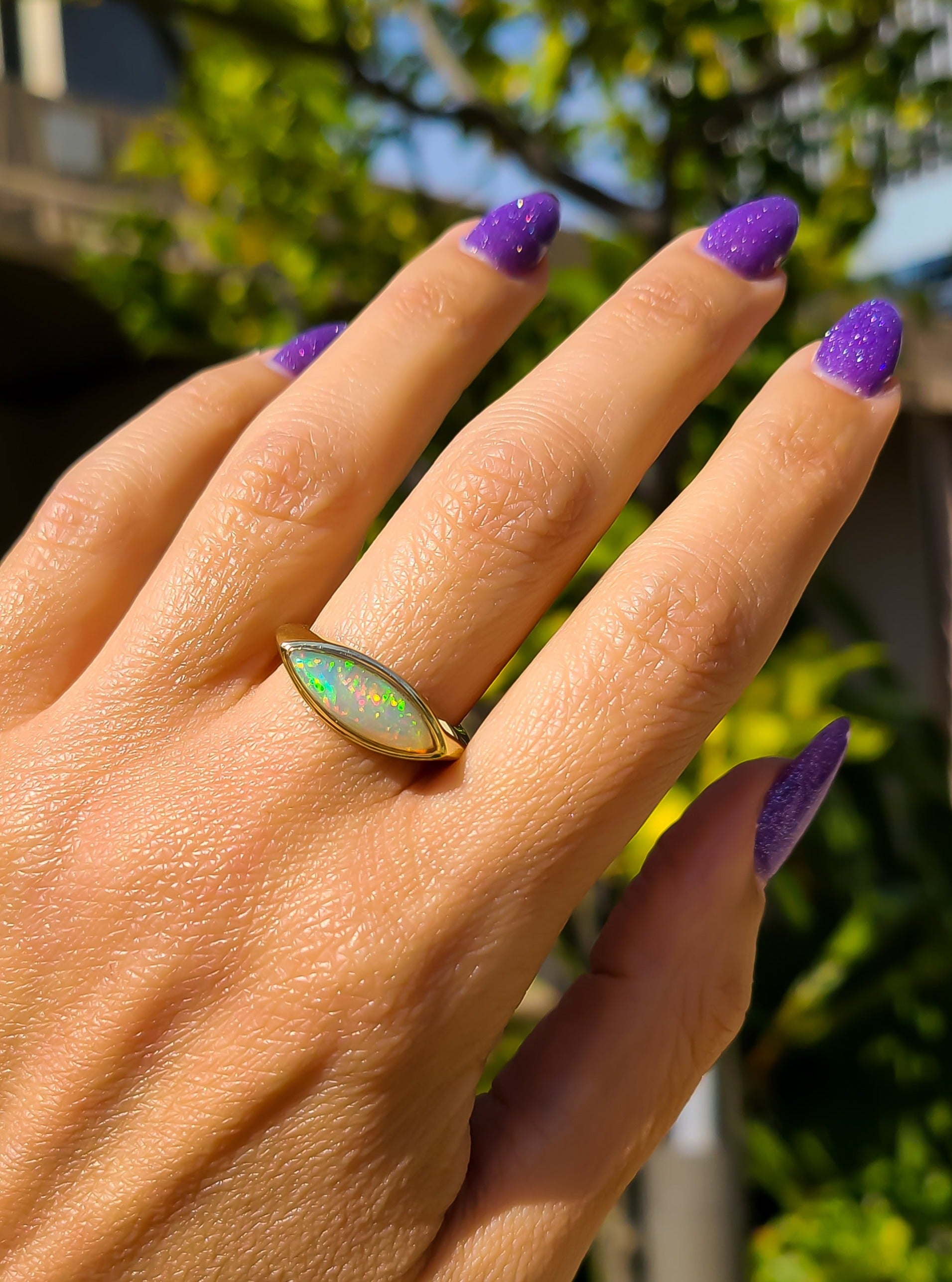 Elongated marquise shape opal ring in 14K gold