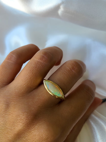 Elongated marquise shape opal ring in 14K gold